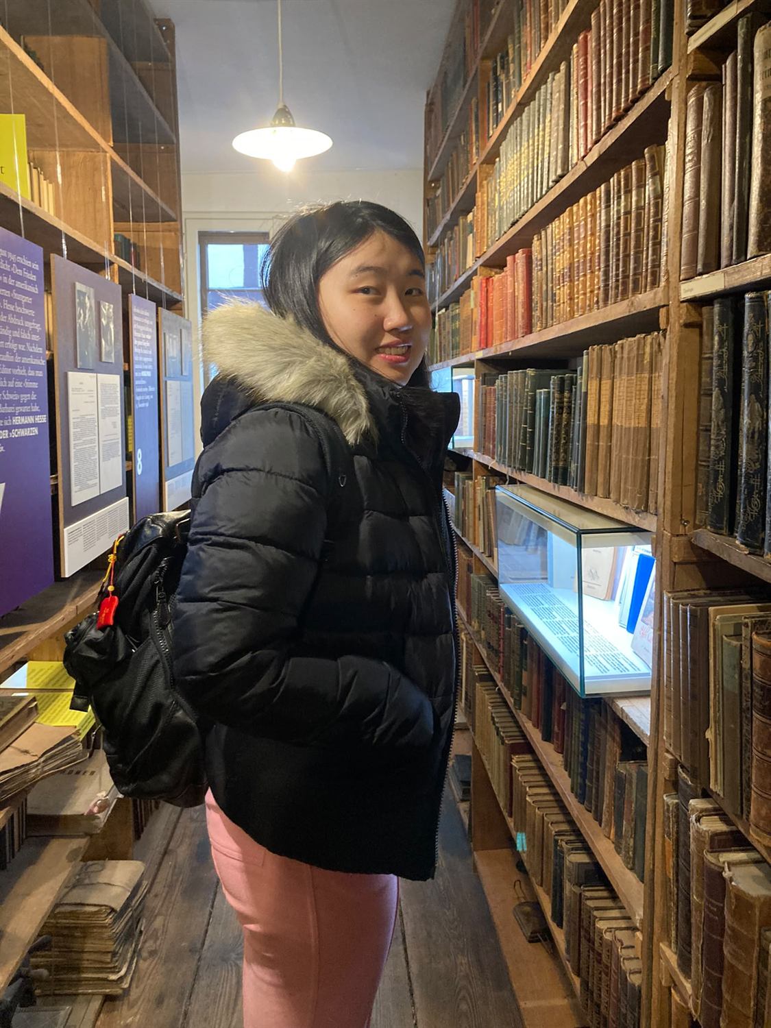 Zhixuan Li among antiquarian books during her visiting period at the University of Tübingen